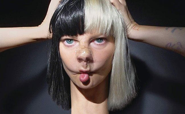 Sia Reveals Her Face After Wind Blows Her Wig