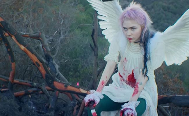 Grimes – “Flesh Without Blood / Life in the Vivid Dream” (Singles Going Steady)