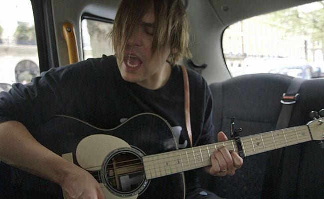 Arcade Fire’s Will Butler Takes to a Black Cab to Play “Madonna” (video)