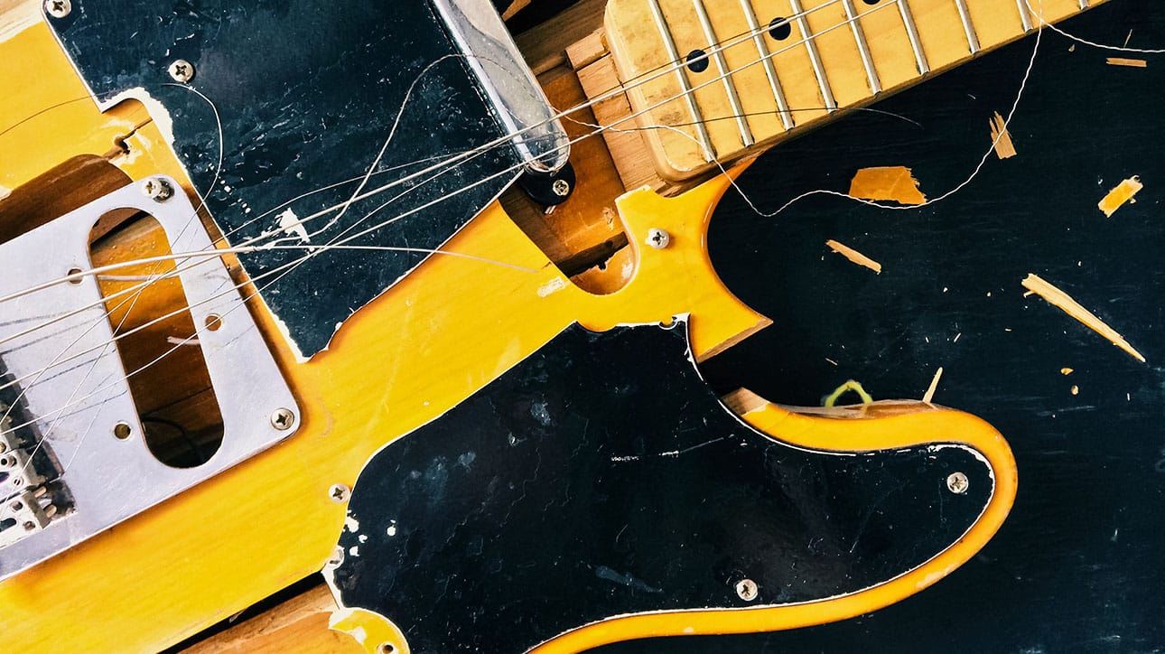 Destroyed Electric Guitar | Adobe Stock